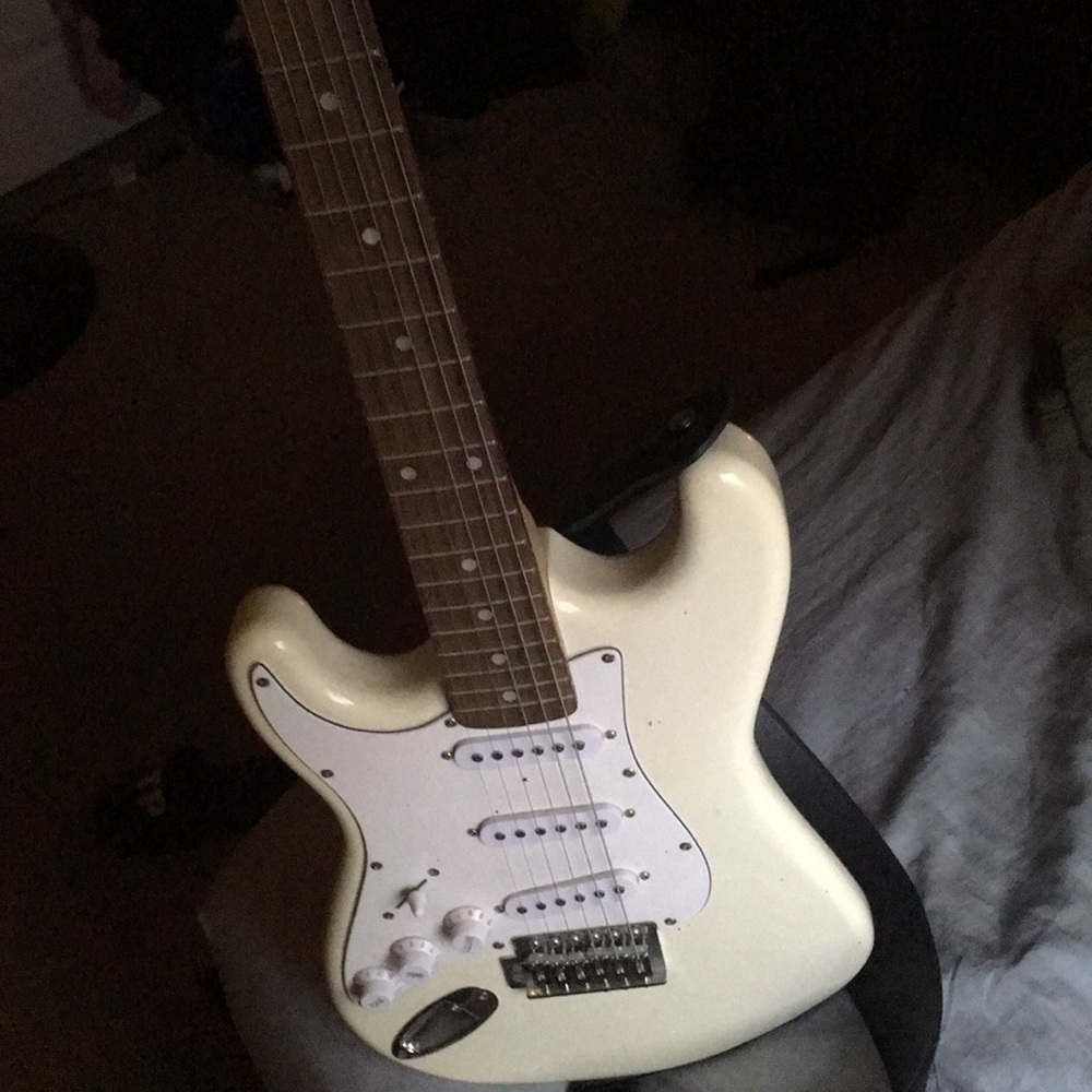 All white left handed electric guitar